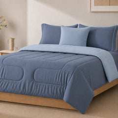 Edredón reversible ARLIN en azul acero y celeste, microfibra 150 hilos con textura suave y acolchado hipoalergénico.
