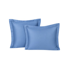 Funda de almohada ARLIN color azul, modelo sham con 150 hilos en mezcla de algodón y poliéster con borde decorativo.